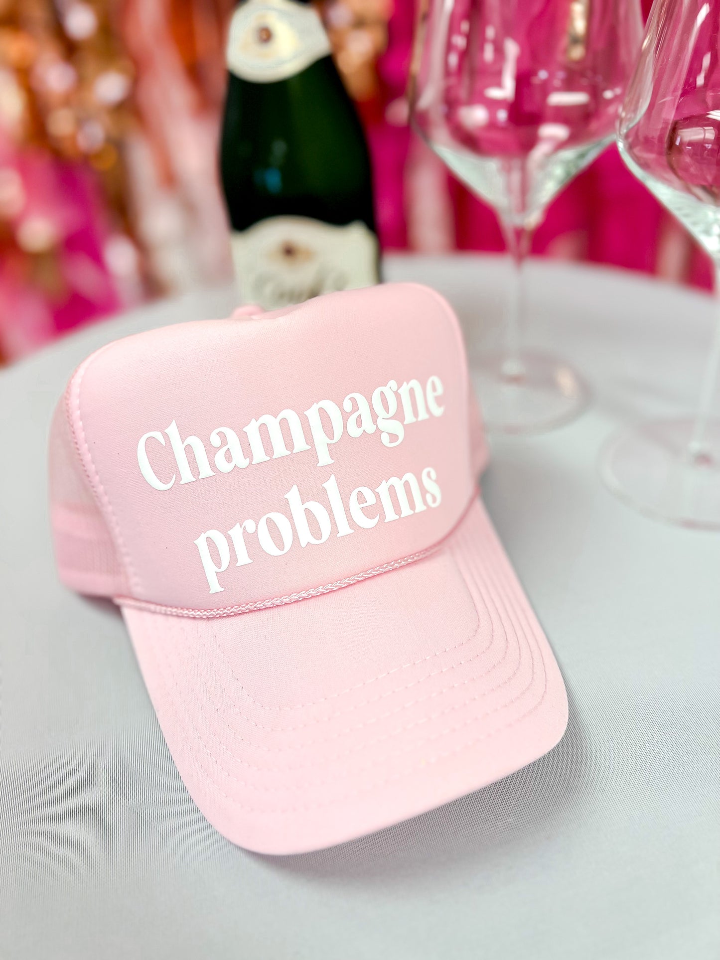 Champagne problems trucker hat